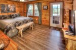 King Bedroom with door leading to screened porch and hot tub
